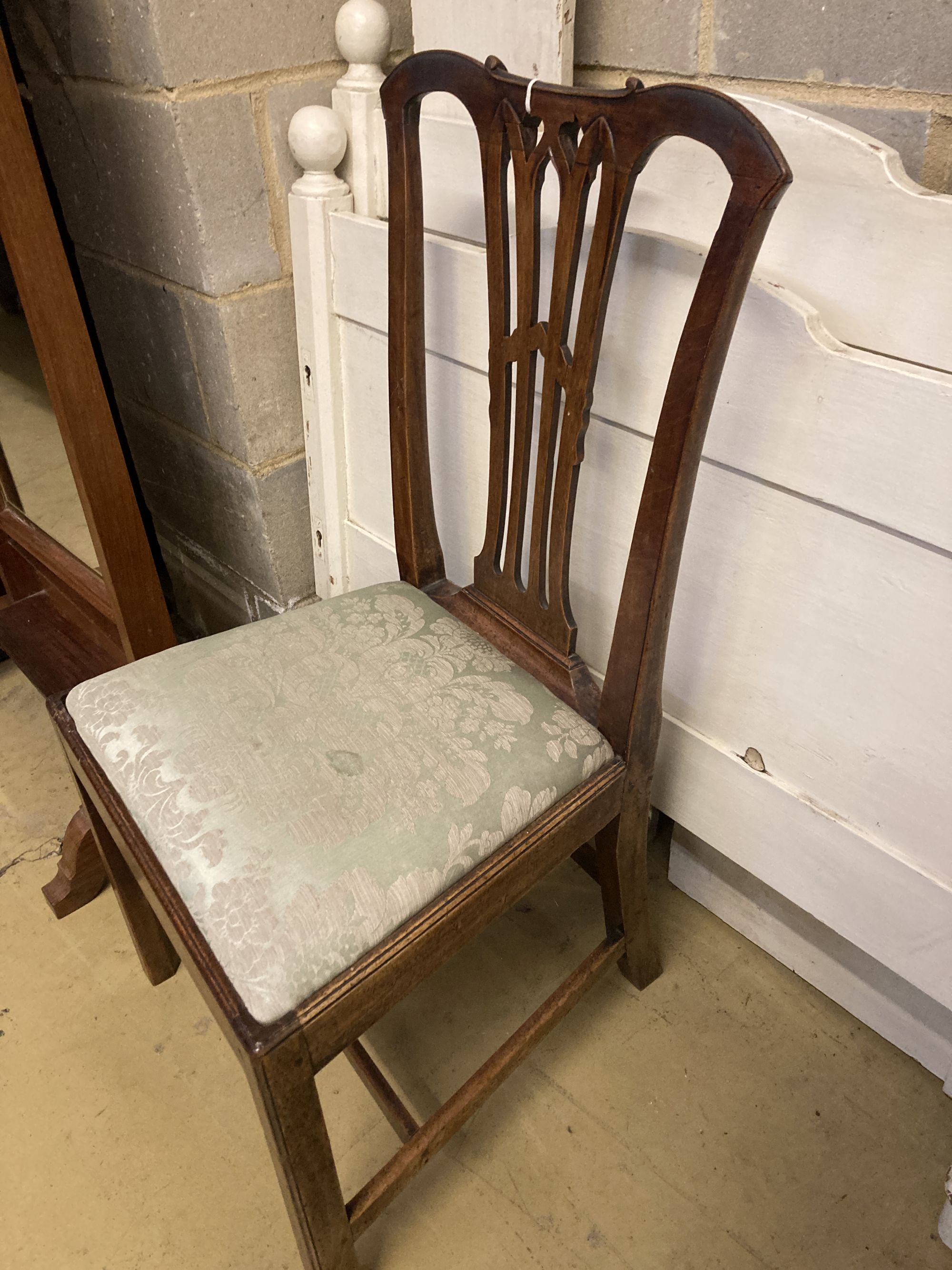 A 19th century Chippendale design mahogany dining chair, with pierced splat back over a drop in set and square underframe